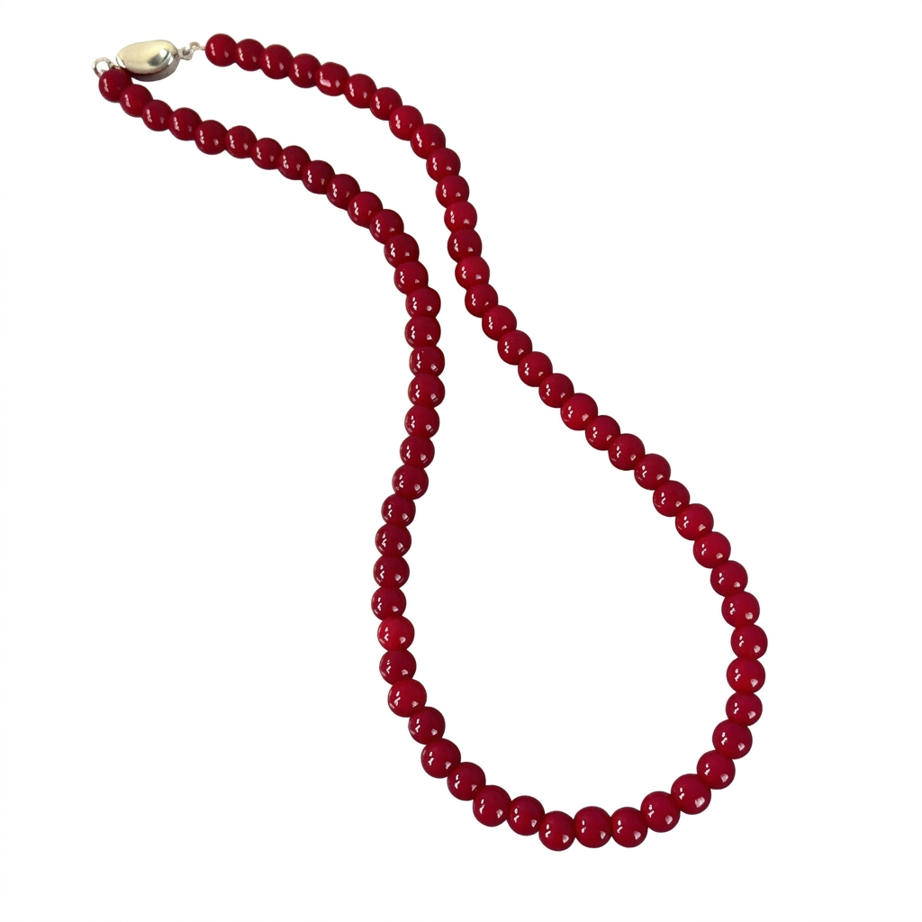 Vintage red glass bead necklace on white